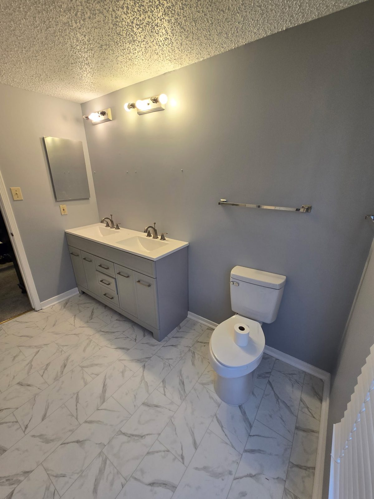 Accessible bathroom with a grab bar and walk-in shower
