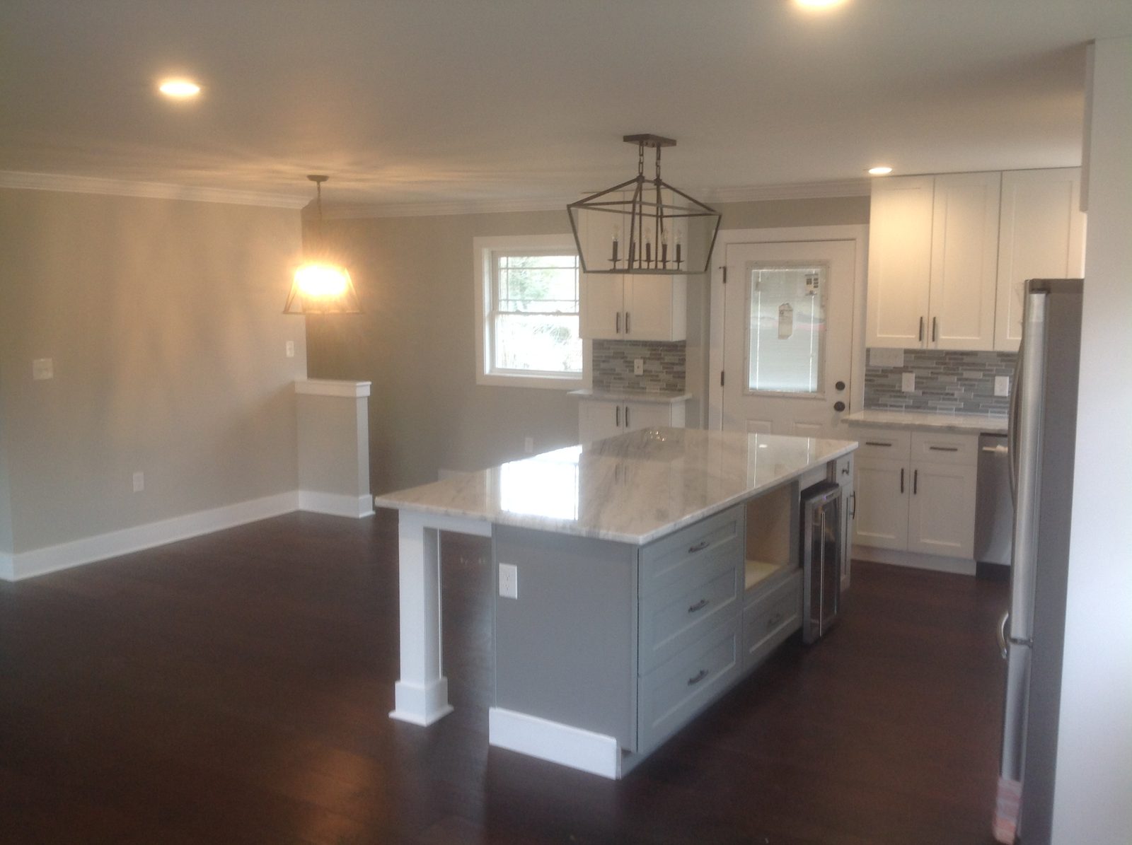 Renovated white kitchen with a large island